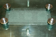 Figure 3. Glass pane with applied TIM mounted to a heatsink.